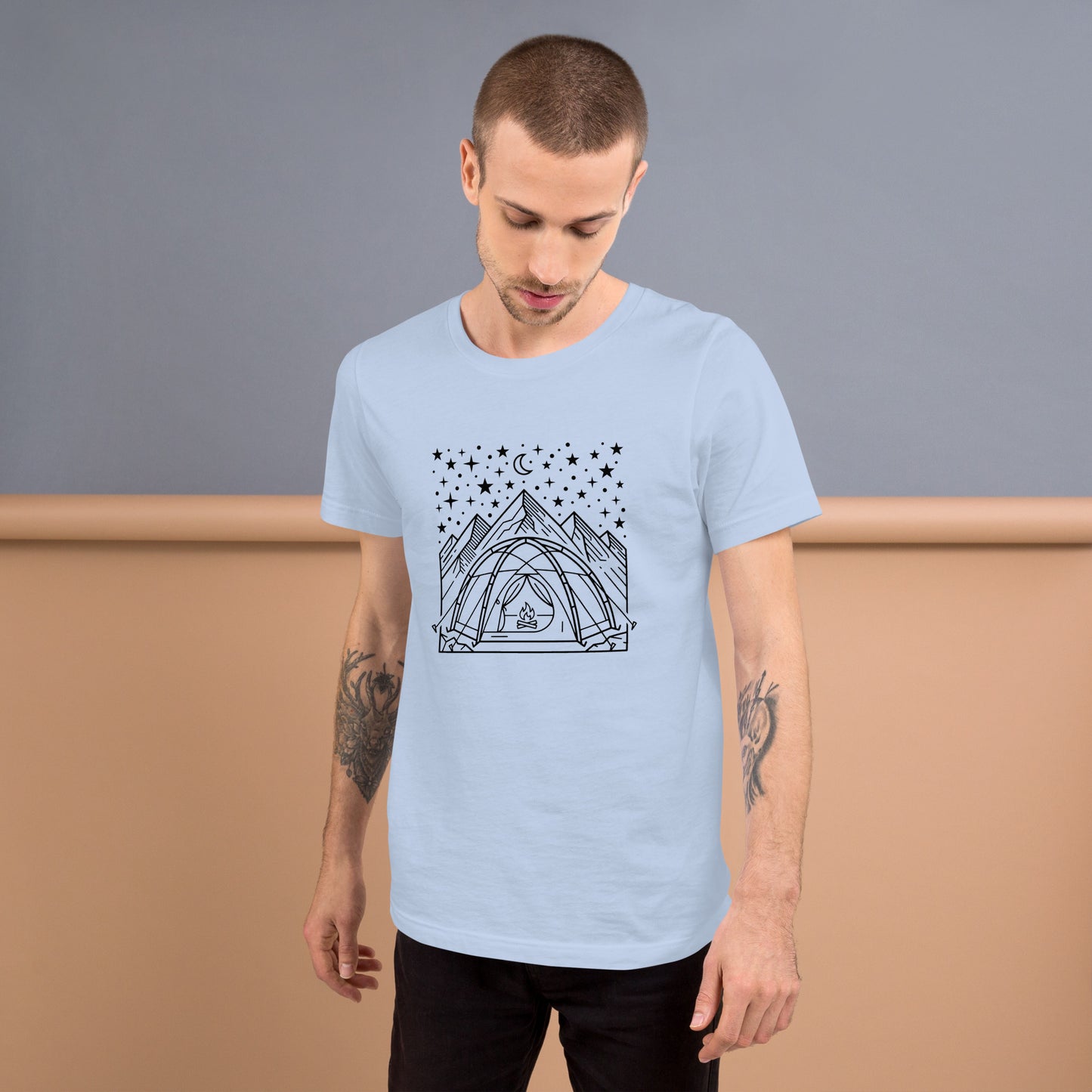 Minimalist camping graphic featuring a tent beneath a star-filled sky with mountains on a premium unisex light blue t-shirt