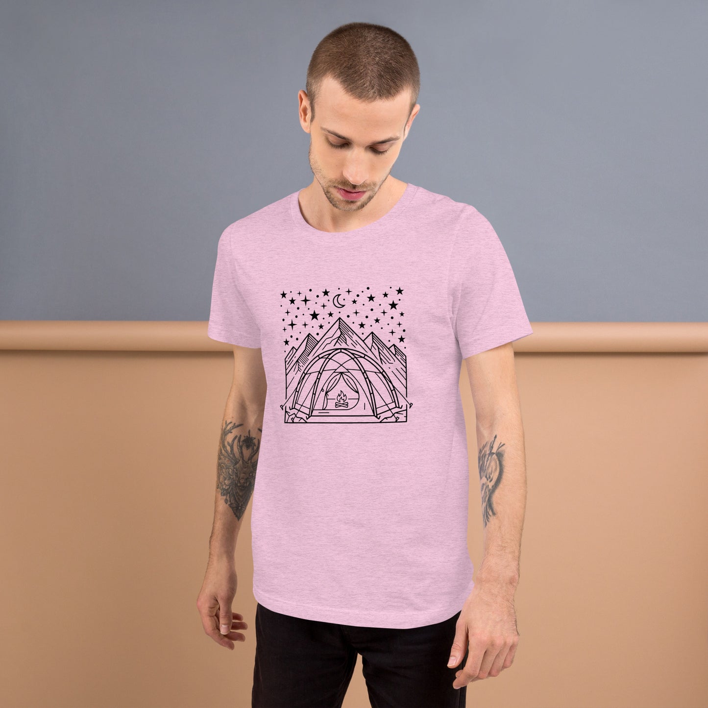 Minimalist camping graphic featuring a tent beneath a star-filled sky with mountains on a premium unisex lilac t-shirt