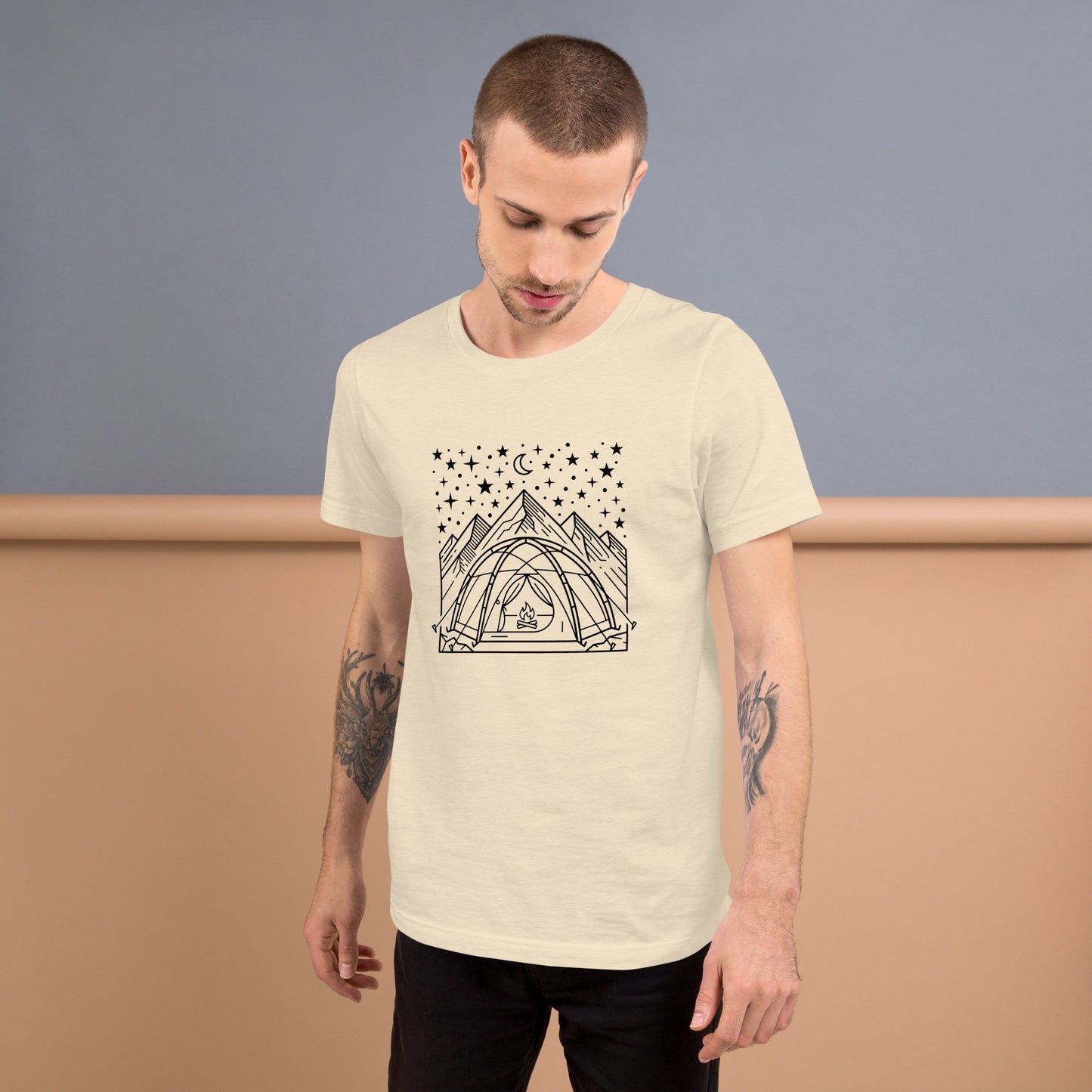 Minimalist camping graphic featuring a tent beneath a star-filled sky with mountains on a premium unisex neutral t-shirt